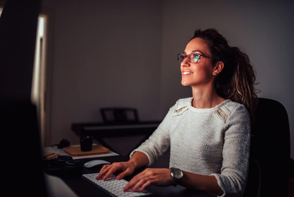 Woman working in computer light